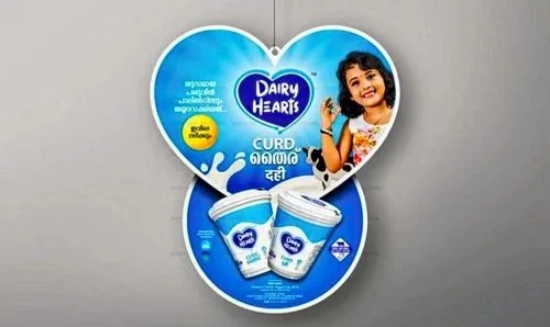 A heart-shaped printed dangler for a curd product